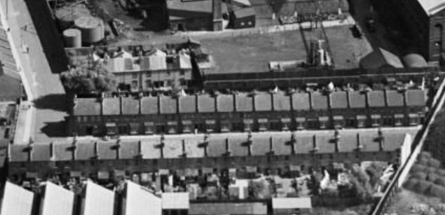 1937 aerial view looking to east. At top of photo is the Mitcham Gas Works. On the right, the footpath is Field Gate Lane. On the bottom of the photo can be seen part of the factory roof of Standard Upholstery. 